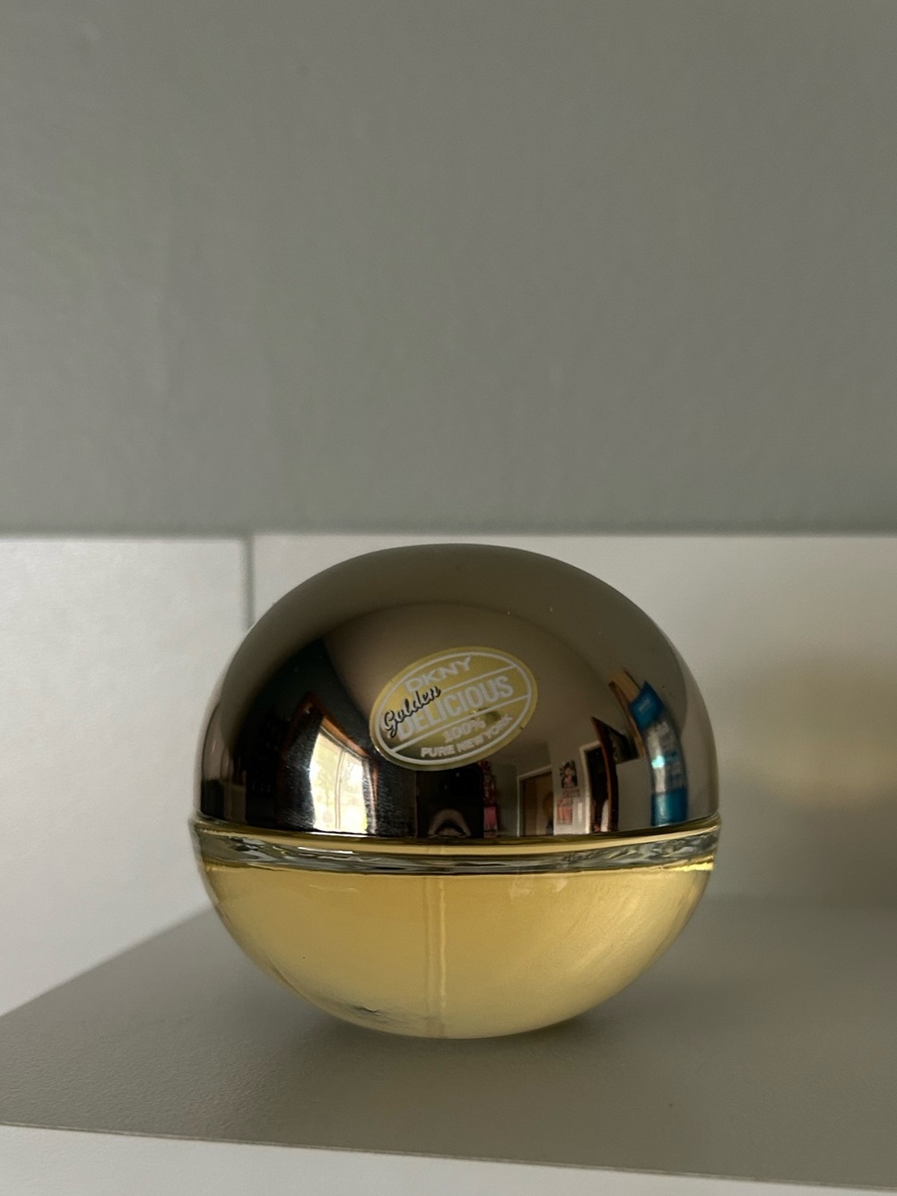 DKNY Golden Delicious perfume bottle